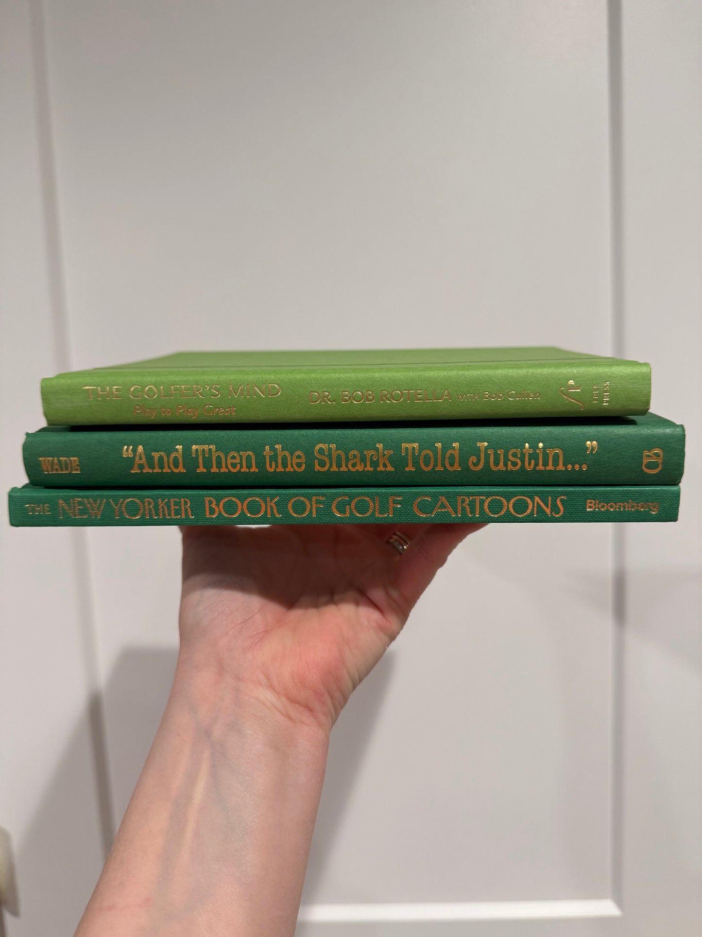 Stack of three golf books