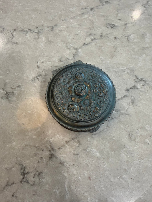 Metal trinket box with floral design